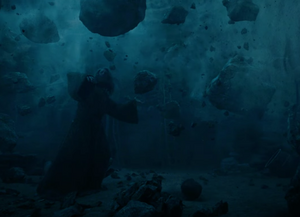 Rings of Power The Stranger Lifts Rocks.png