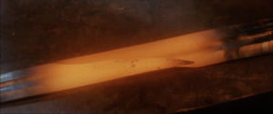 The Lord of the Rings - The Return of the King - The Reforging of Narsil.png